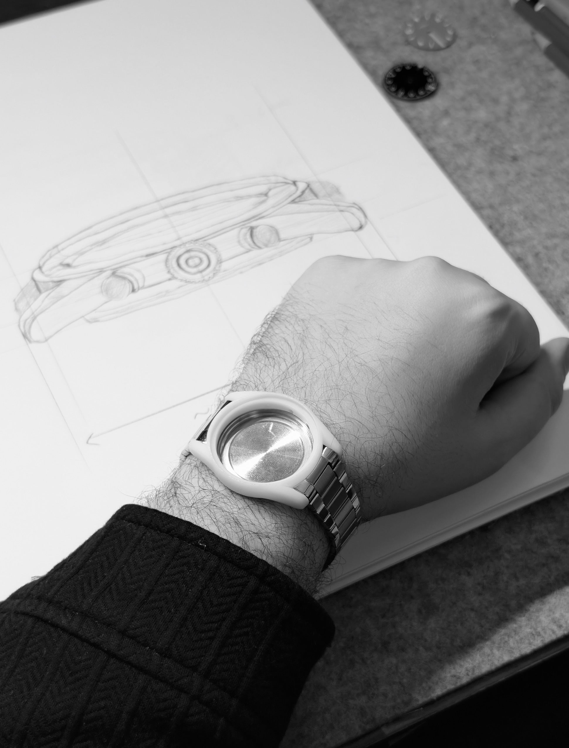 The case in profile on the wrist, framing the dial